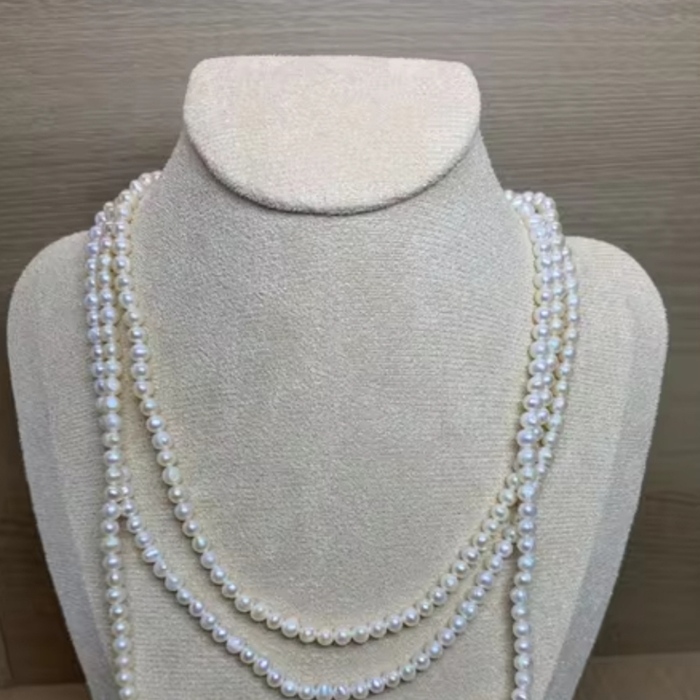 Strand of long mini moon pearls